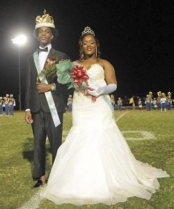 Selma High School Homecoming King Tyriq Fells and Homecoming Queen Zion Edwards pose for a pciture Friday night during halftime after being crowned King and Queen. (Blake Deshazo | Times-Journal)