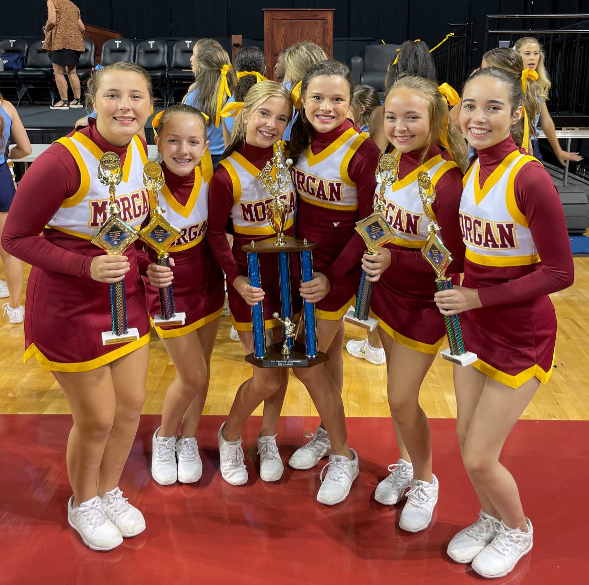 Academy JV cheerleaders win AISA small squad state title The